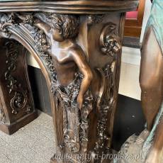 MONUMENTALNY KOMINEK Z BRĄZU postacie portal kominkowy